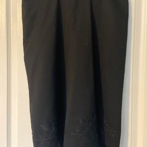 Black skirt with chiffon and beaded design at hemline